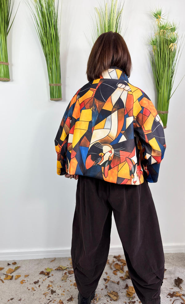 New york pulse asymetric jacket in orange and multi.
