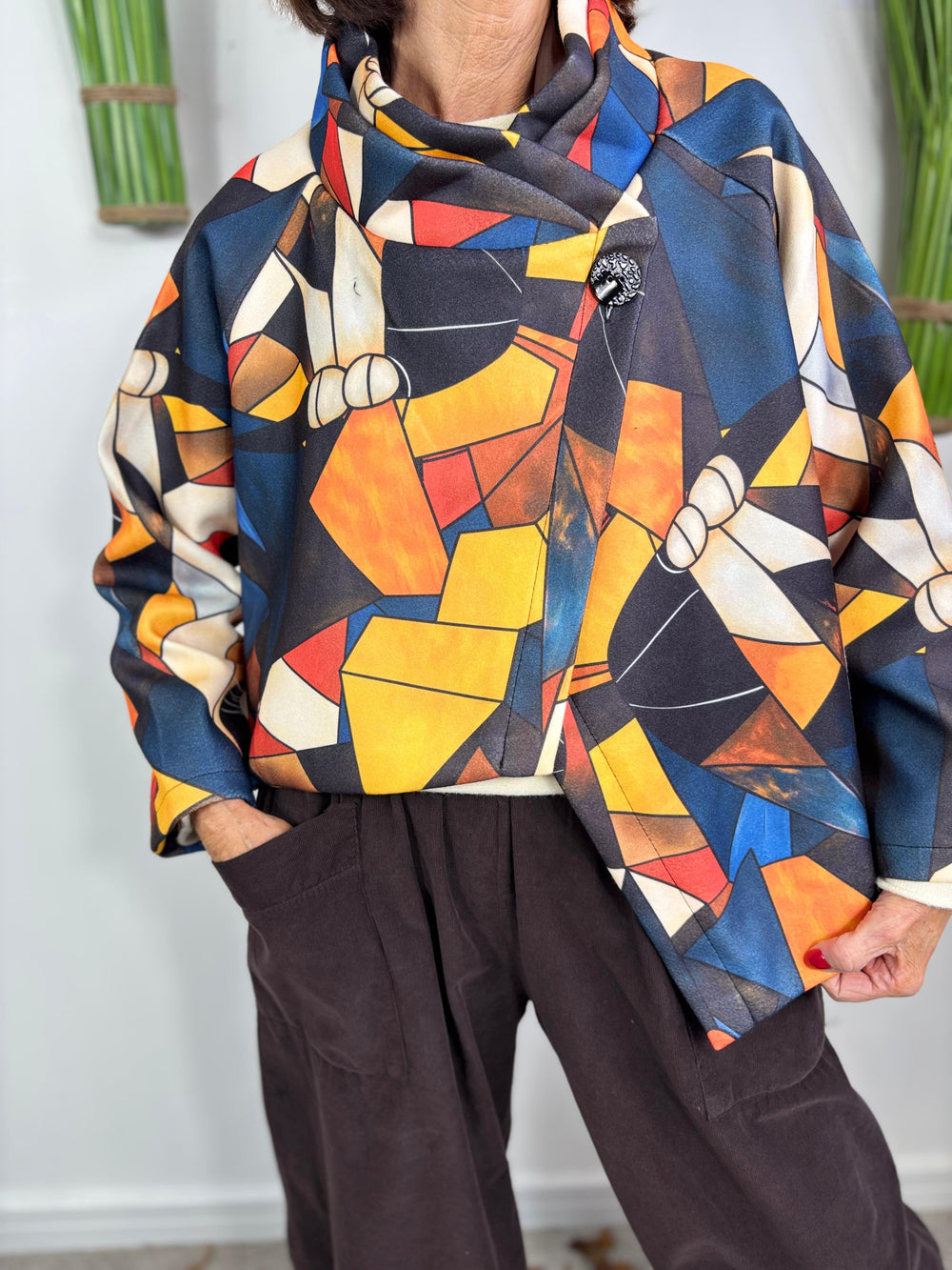 New york pulse asymetric jacket in orange and multi.