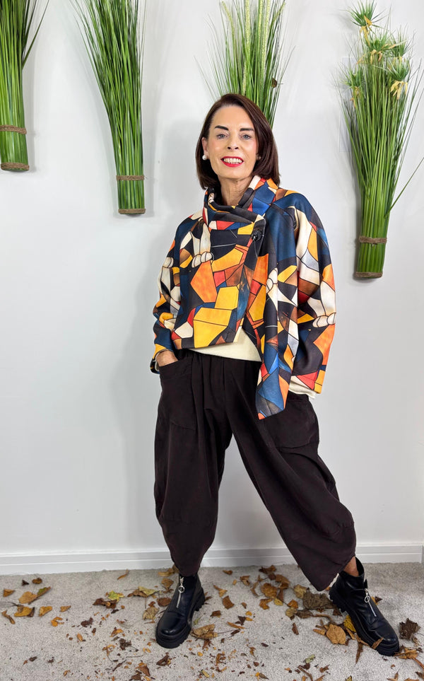 New york pulse asymetric jacket in orange and multi.