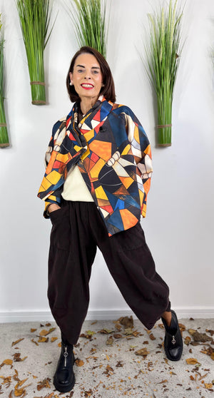 New york pulse asymetric jacket in orange and multi.