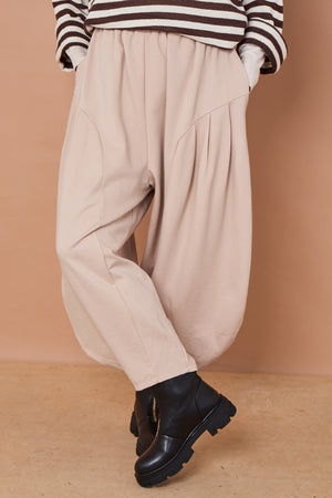 Della cocoon trousers in stone scuba fabric