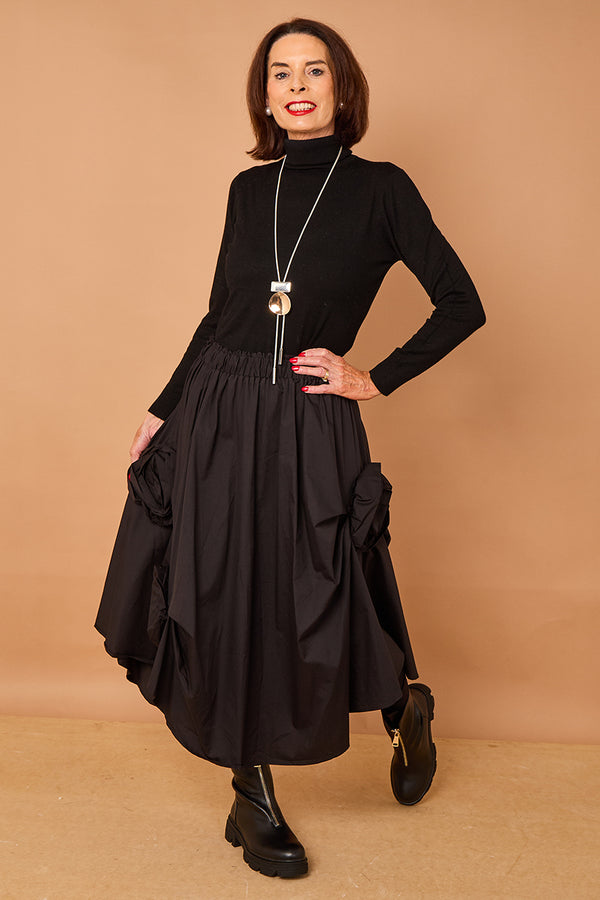 Patchouli roll neck top in black
