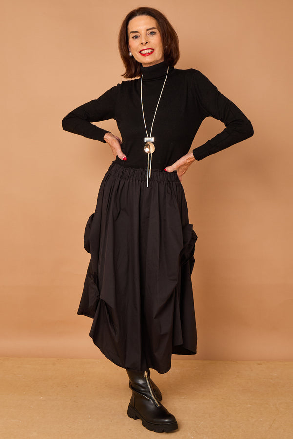 Patchouli roll neck top in black