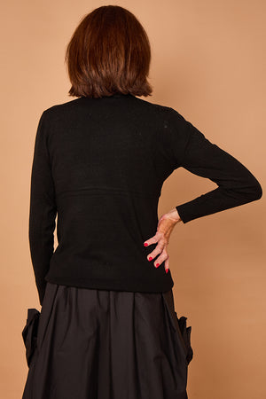 Patchouli roll neck top in black