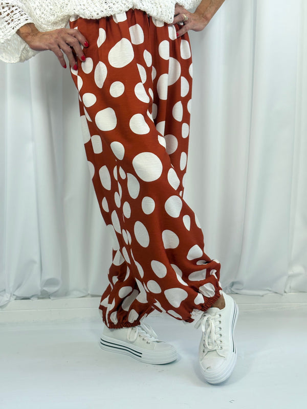 Dora trousers in rust with white polka dots - Pre order arrival date 29 june