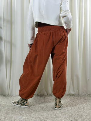 Sofia pin cord balloon trousers in rust